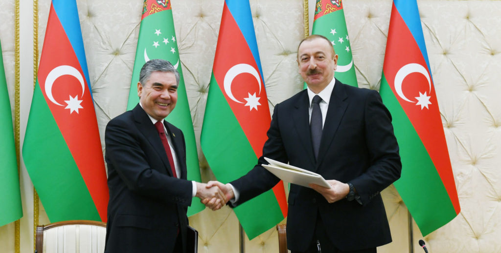 The presidents of Turkmenistan and Azerbaijan shaking hands