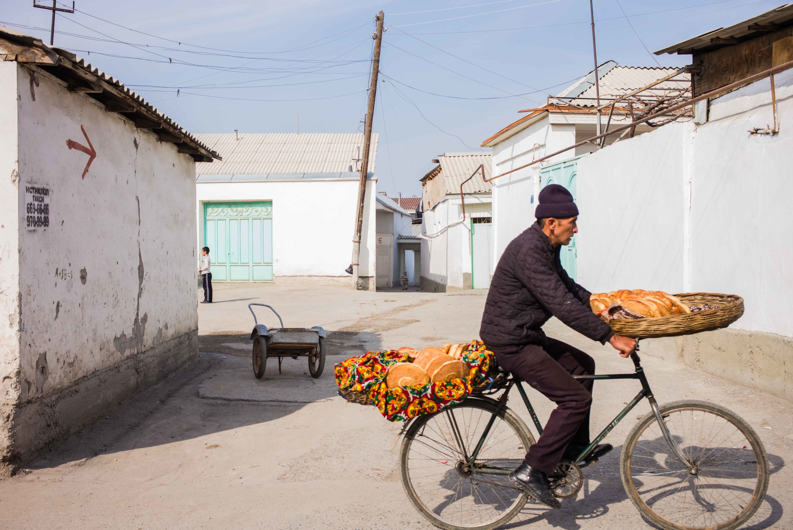 Uzbekistan Fergana Margilan bicycle bread seller