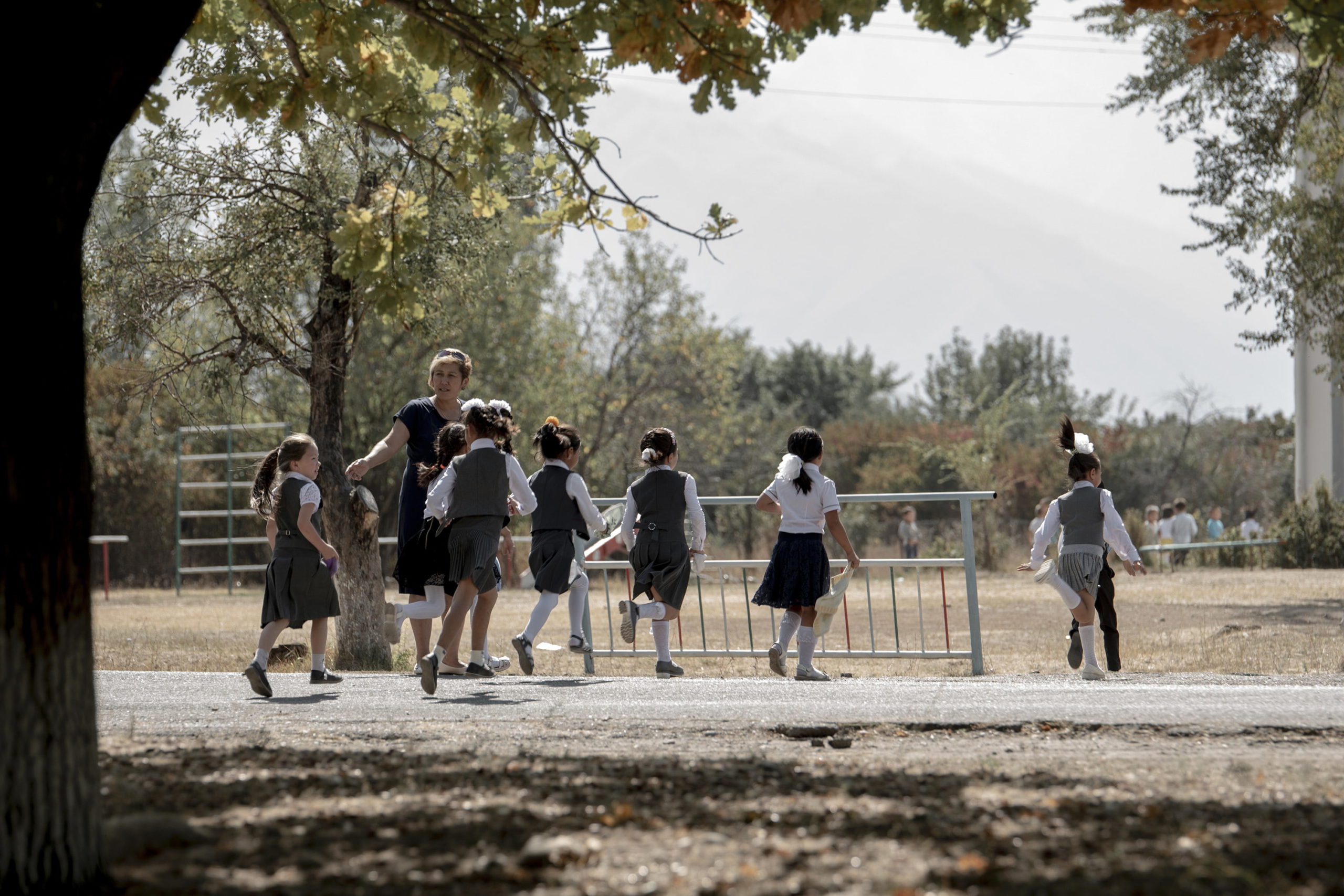 Pupils from a school in Kyrgyzstan crossing a road