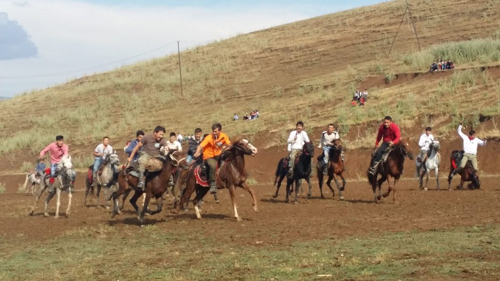 Members of the Van Kyrgyz community play the traditional game Kok-Boru.