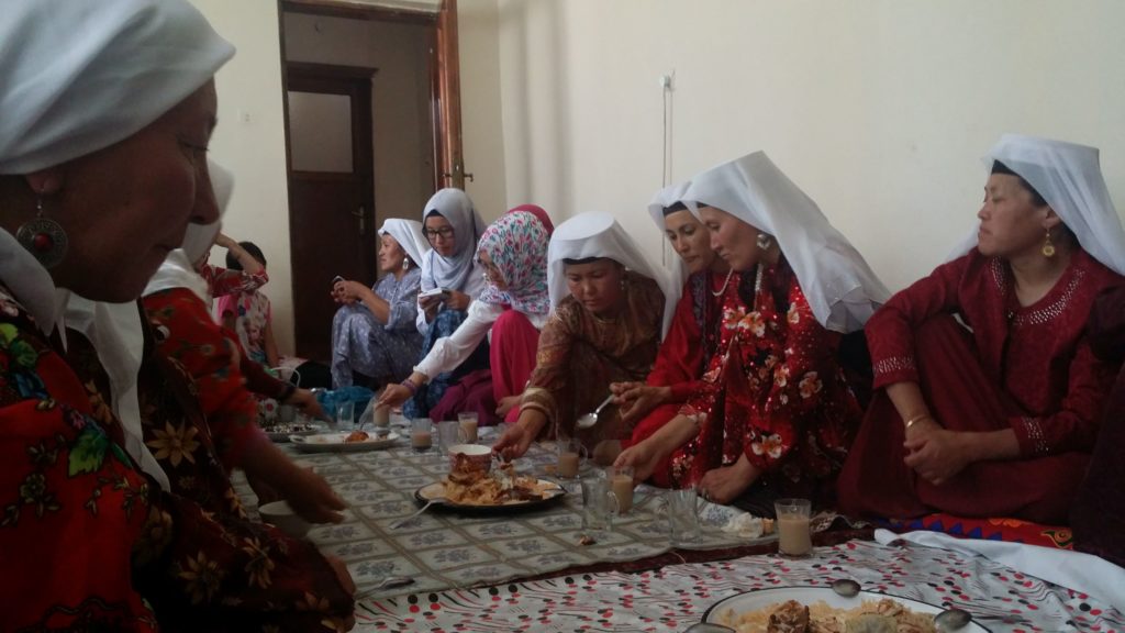 Van Kyrgyz women gather to eat.