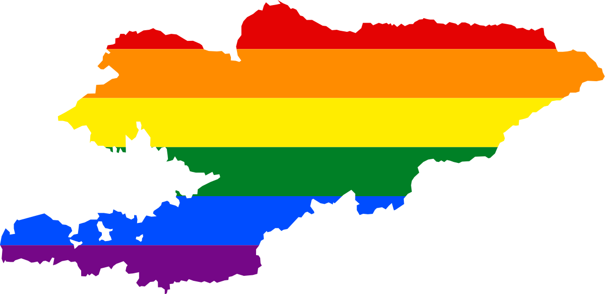 The rainbow flag, a symbol of the LGBT community, in the shape of Kyrgyzstan. Illustration from Wikimedia Commons.