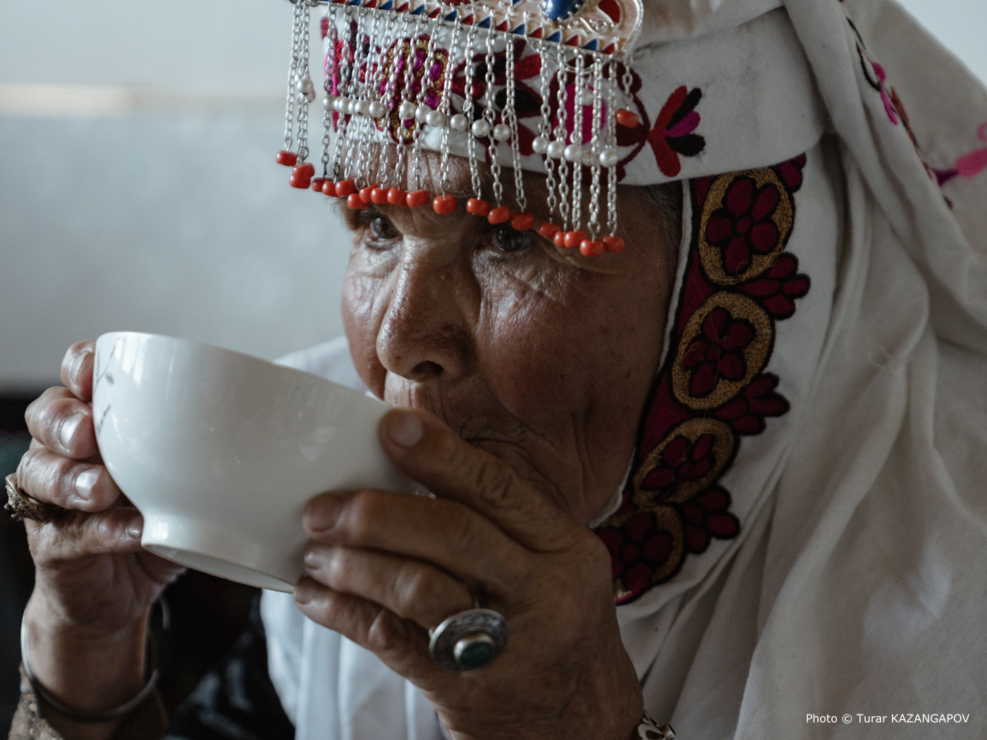 Xinjiang elderly woman in traditional outfit Turar Kazangapov