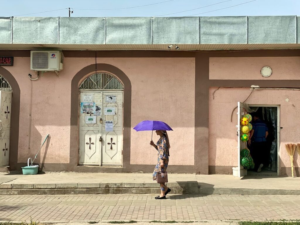 Tadjikistan Danghara sunny street view with umbrella