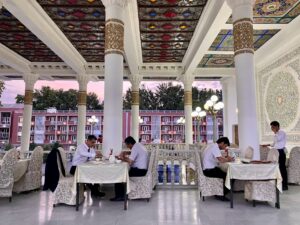 Dushanbe - Tajik men enjoy a meal at Chaihona Rohat.