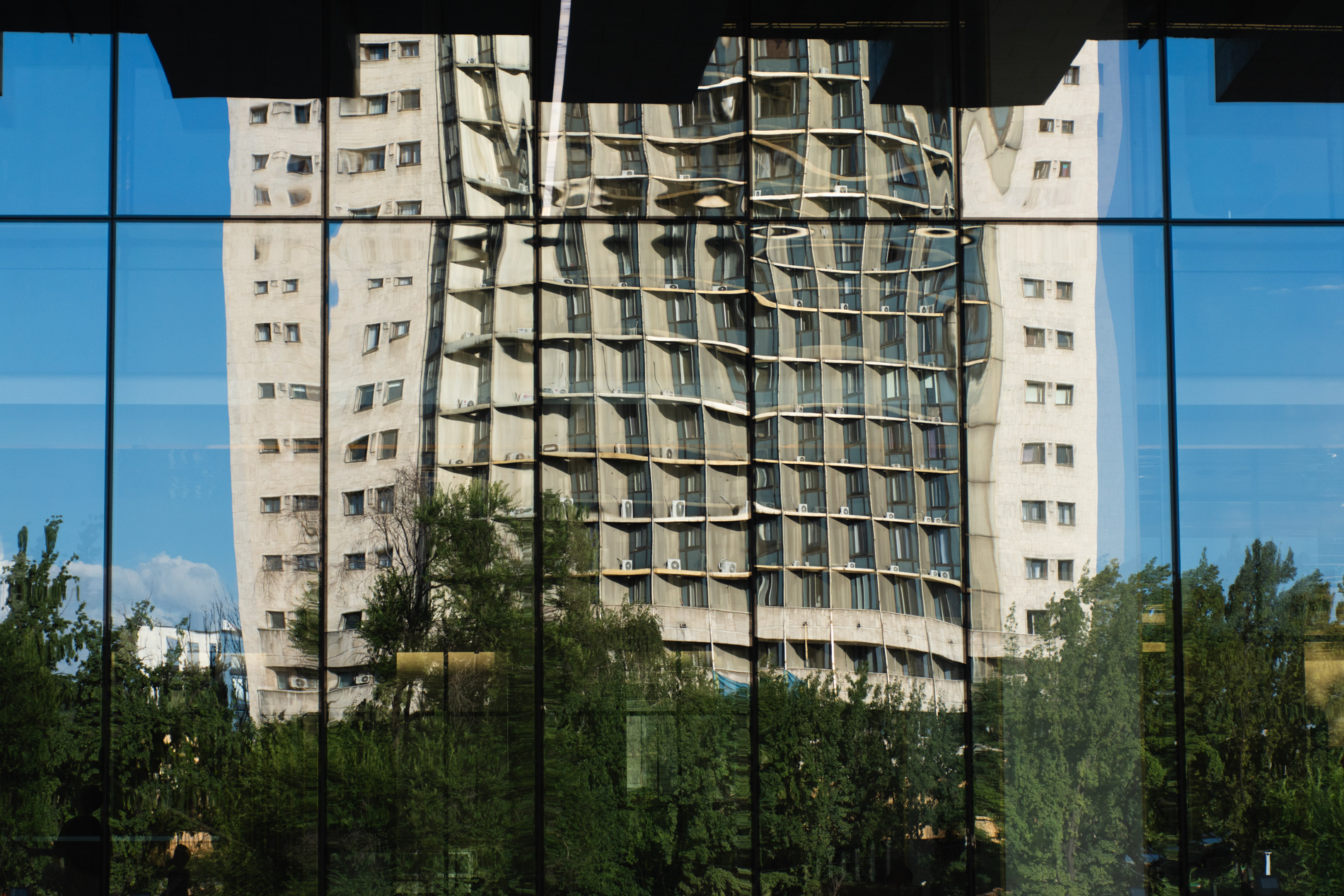 buildings mirror glass refections almaty