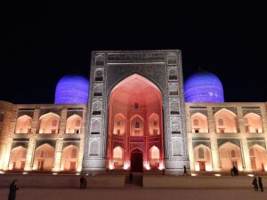 The Mir-i-Arab Madrasa illuminated at night in Bukhara's Po-i-Kalyan complex. Credits: Mathieu Lemoine.