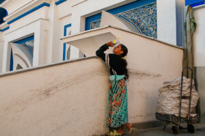 A young girl quenching her thirst in Tashkent