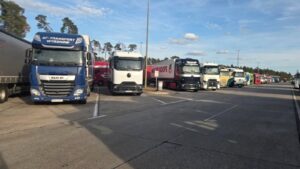 Trucks parked at a motorway rest area in Europe. Long-distance drivers often spend extended periods living and sleeping in their vehicles between assignments. Photo courtesy of Alex.
