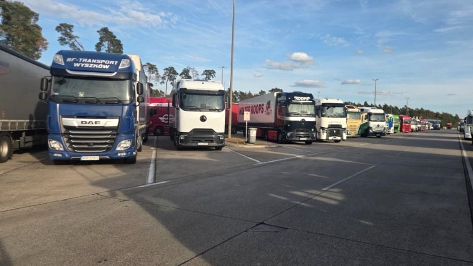 Trucks parked at a motorway rest area in Europe. Long-distance drivers often spend extended periods living and sleeping in their vehicles between assignments. Photo courtesy of Alex.